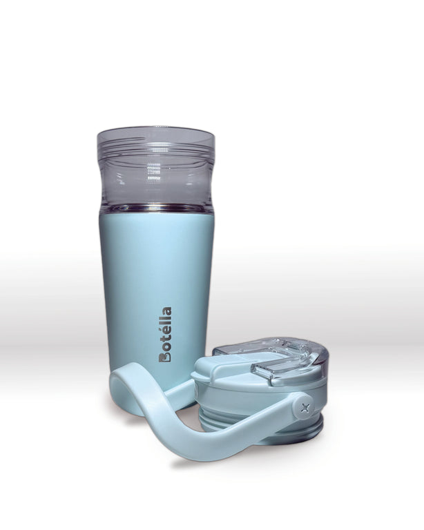 Light blue nesting tumbler with detachable blue lid on a white background